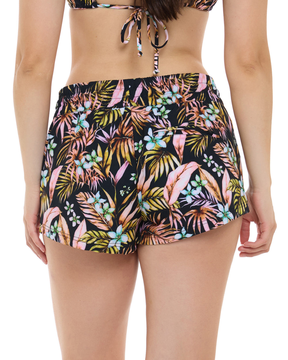 Rear close up view of woman wearing black floral print shorts