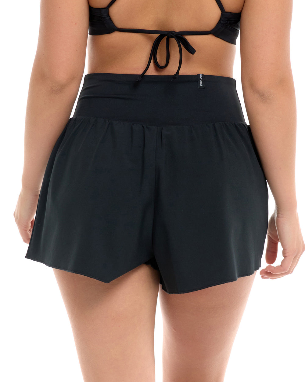 rear view of woman wearing black shorts