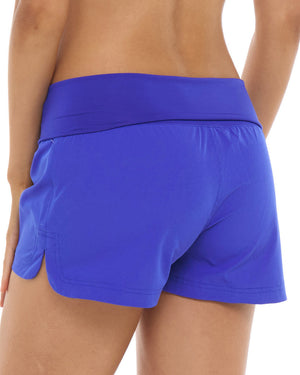 closeup of woman wearing blue shorts