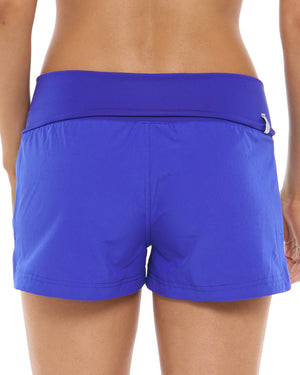 closeup of woman wearing blue shorts