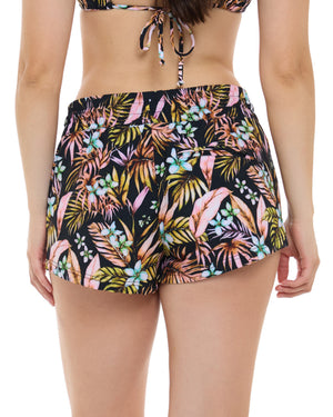 Rear close up view of woman wearing black floral print shorts