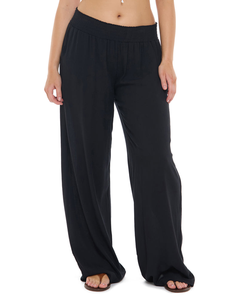 Black wide-leg lounge pants with an elastic waistband, shown on a model from the waist down against a white background. - Primary view 1