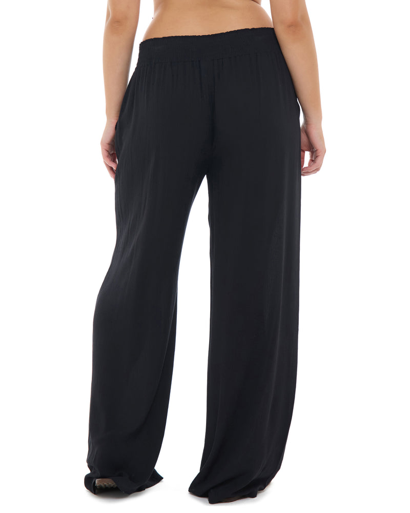  Black wide-leg lounge pants with an elastic waistband, shown on a model from the waist down against a white background. - Secondary view 2